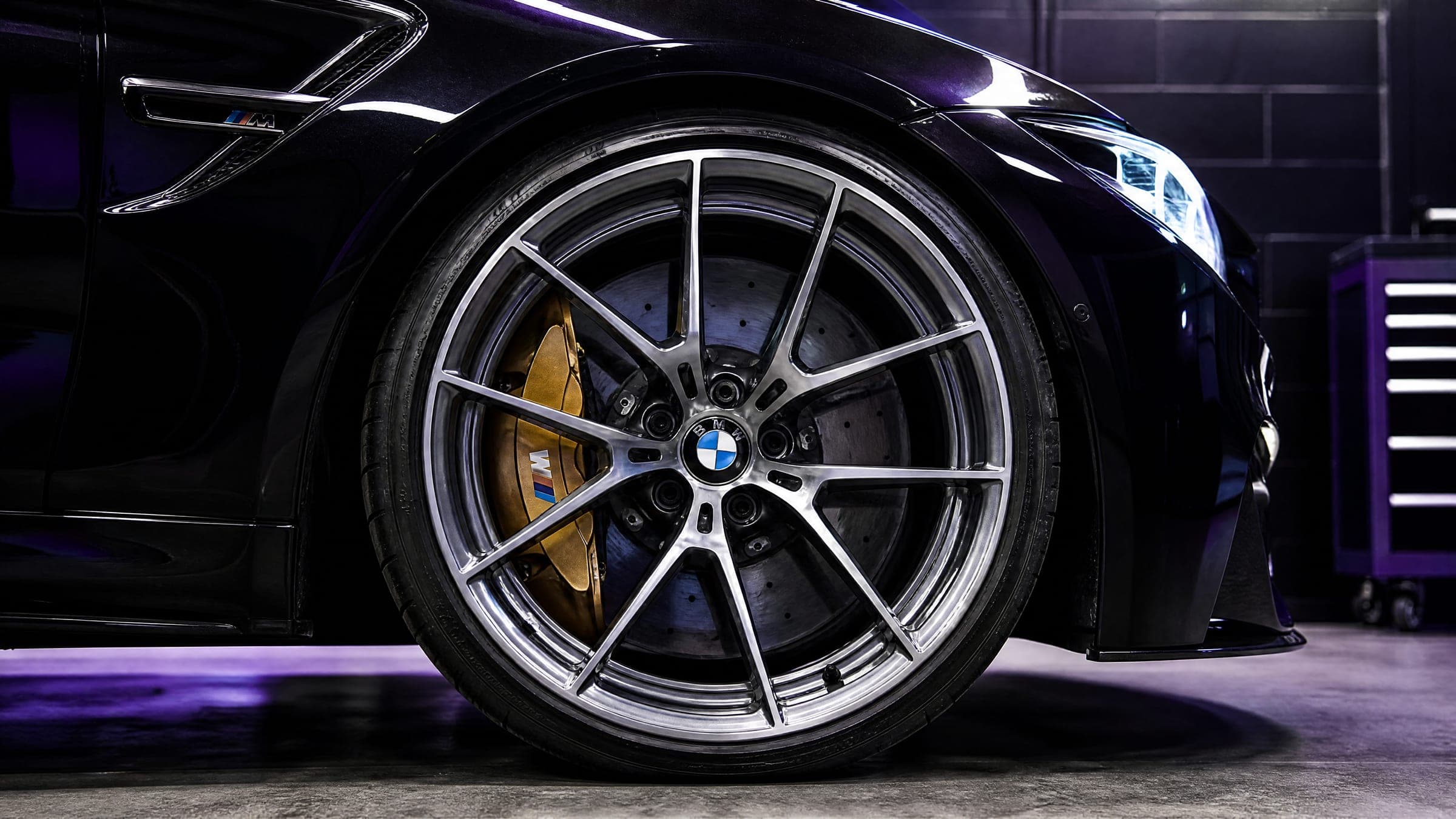Close-up of a performance alloy wheel and brake caliper